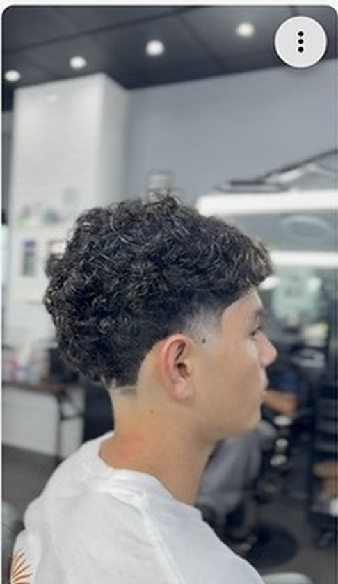 Curly taper haircut by Chris Nopy